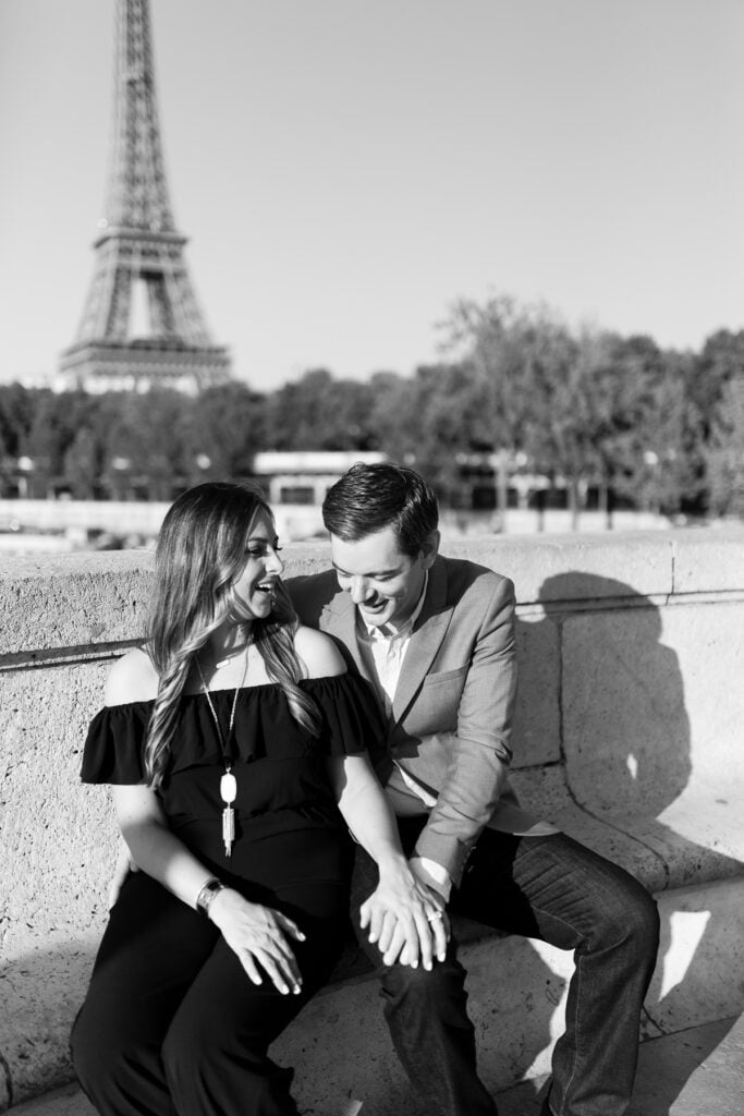 Couple standing behind their dog at Trocadéro, Eiffel Tower in the background