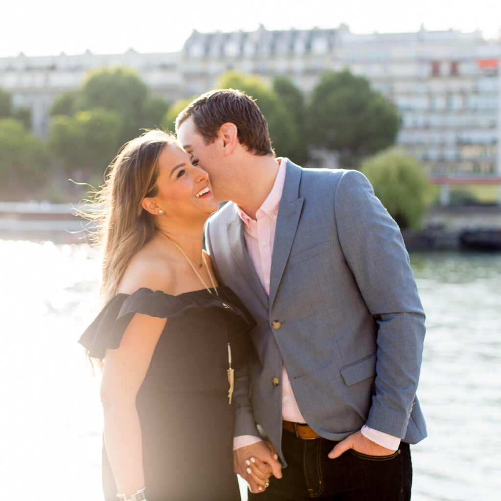 Couple hugging on a garden path in the Champ de Mars in winter
