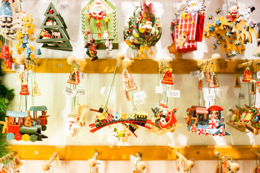 Colorful wooden Christmas ornaments on display in a shop in Riquewihr