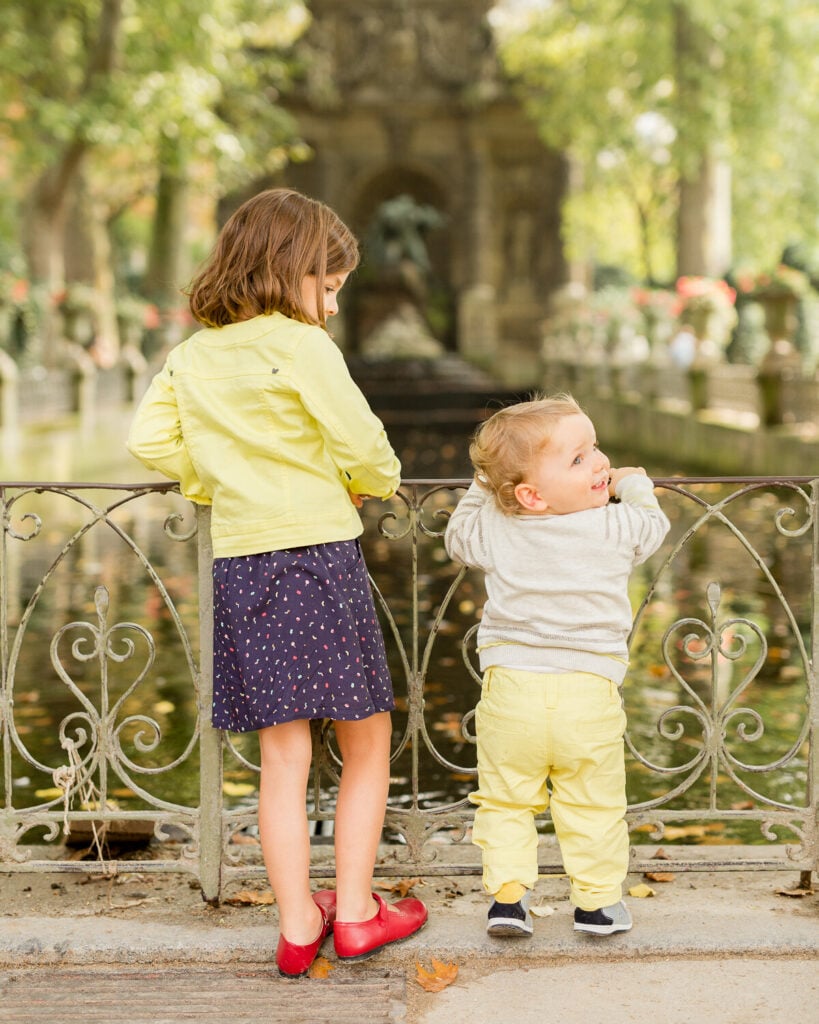 Portrait of two young kids at pond in Luxembourg Gardens: Visiting Paris in August by Katie Donnelly Photography