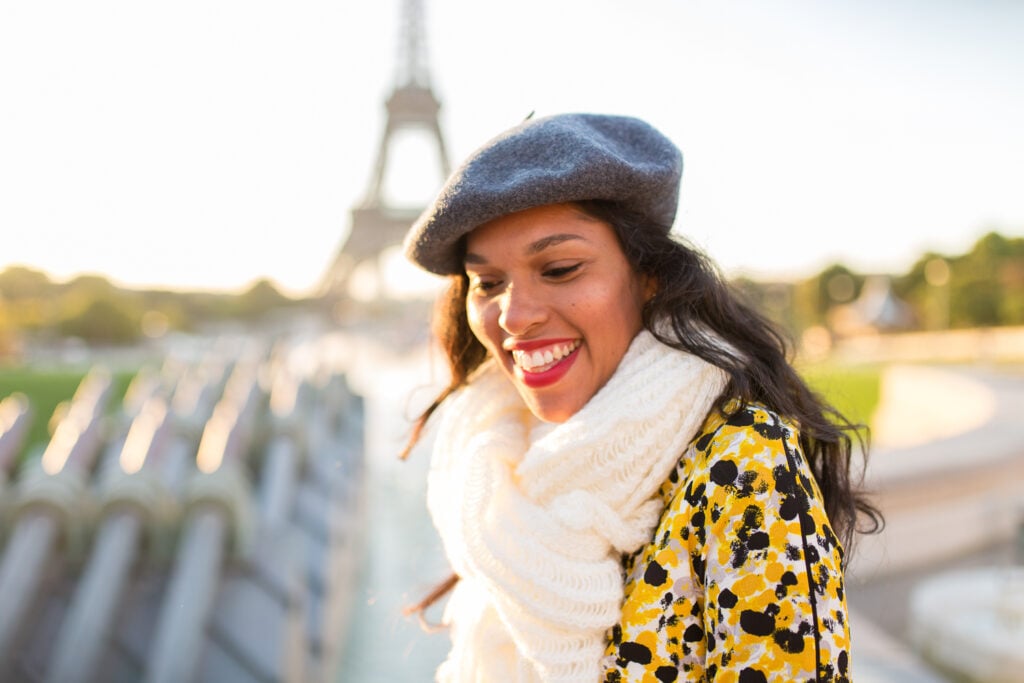Portrait of woman with blue beret in front of Eiffel Tower: Fall Packing Guide for Paris by Katie Donnelly Photography