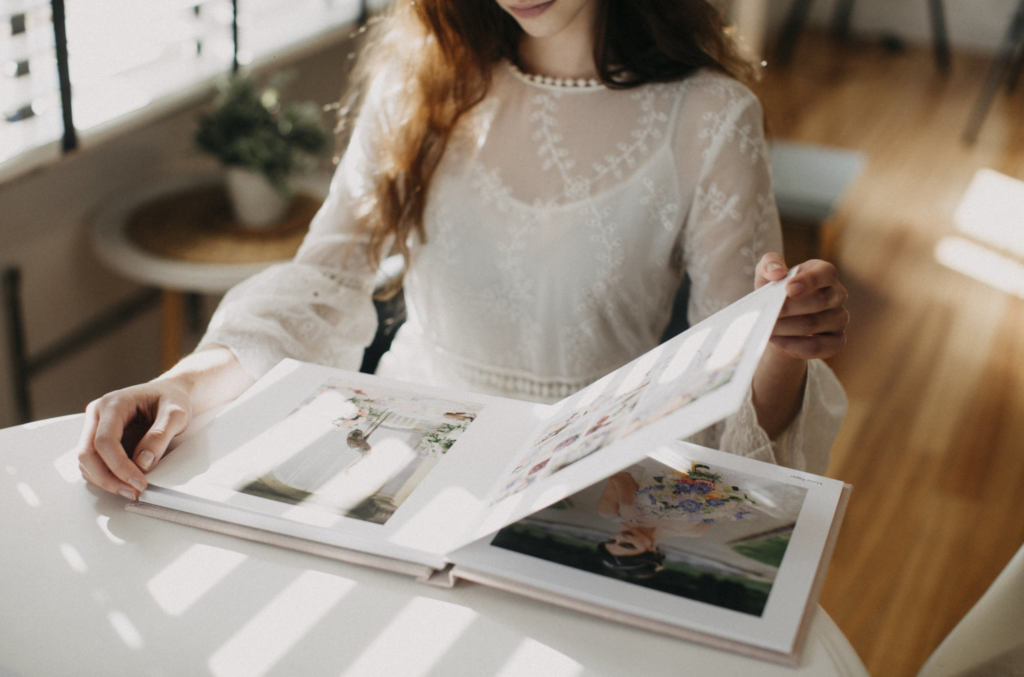 Picture of woman flipping through fine art photo album by Katie Donnelly Photography
