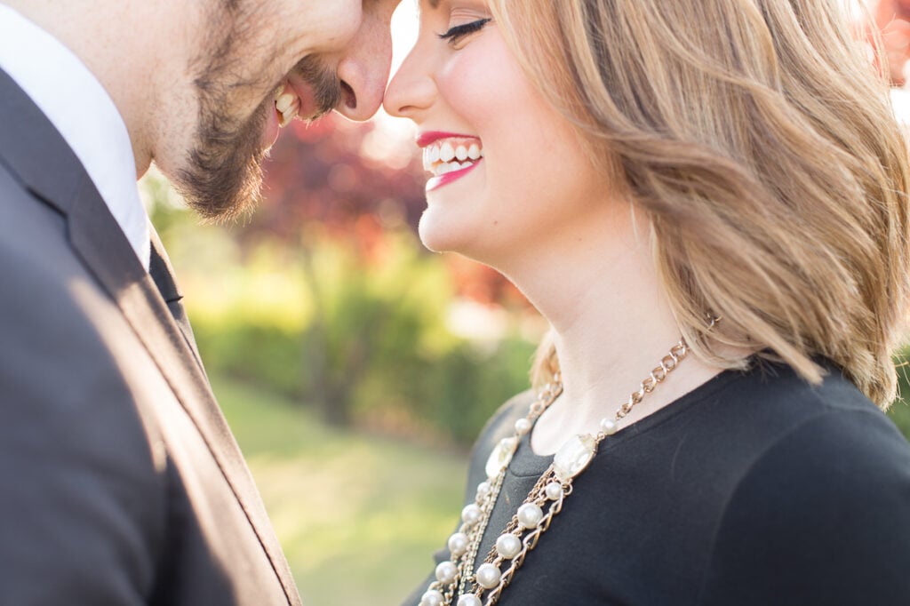 Close-up of a couple laughing nose to nose during a honeymoon photoshoot in Paris