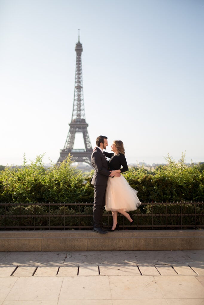 Couple kissing at Trocadéro with a full view of the Eiffel Tower
