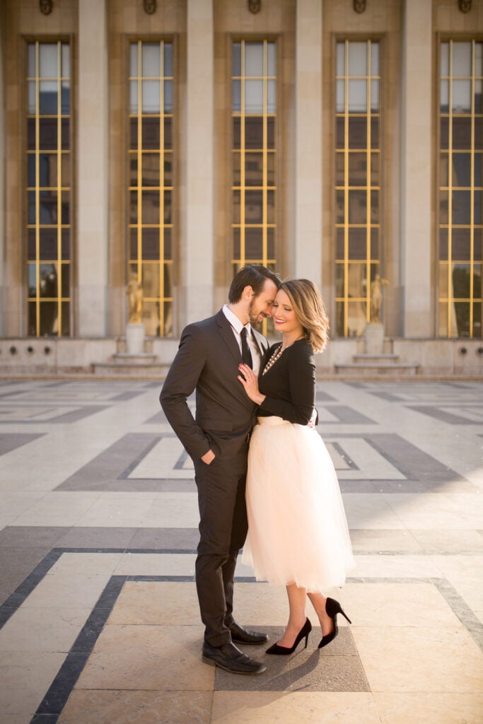 Couple kissing on the patterned stone floor at Trocadéro, Paris