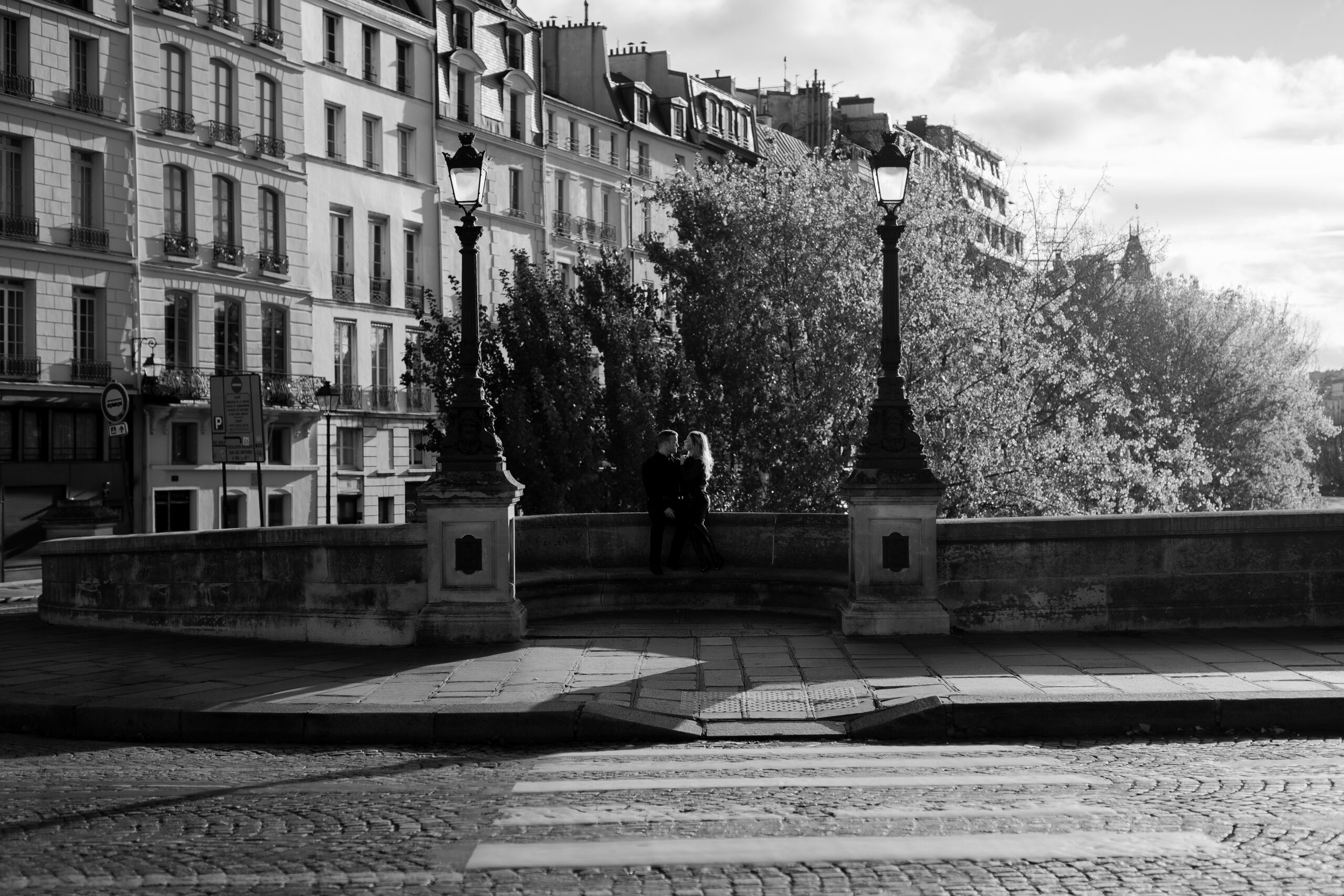 Romantic couples portrait on Pont Neuf in Paris by photographer Katie Donnelly