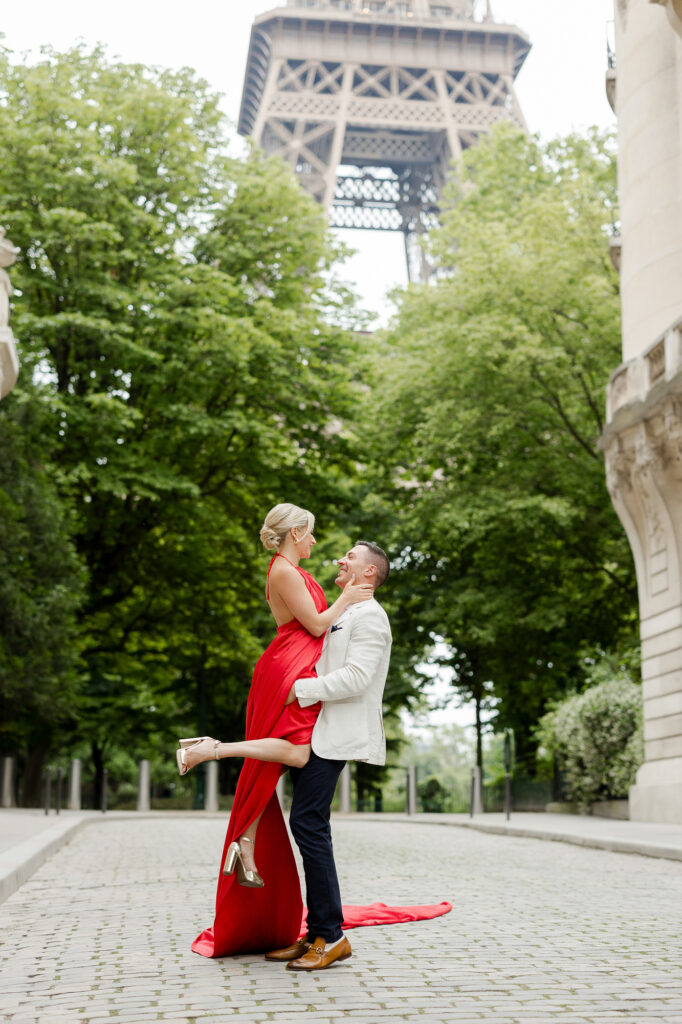 Romantic color portrait of couple embracing in Paris near Eiffel Tower by Katie Donnelly Photography