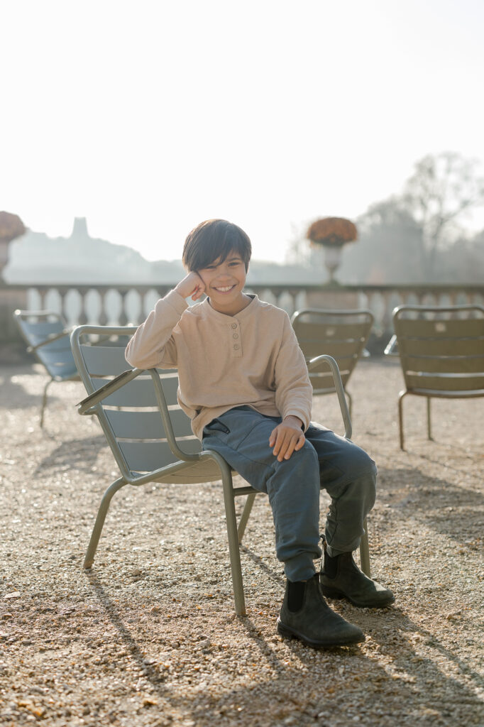 Portrait of a young boy at Luxembourg Gardens in Paris by Katie Donnelly Photography