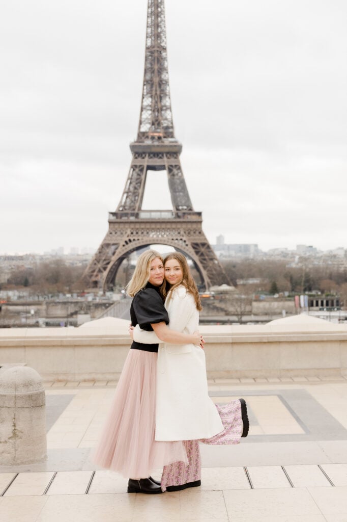 Portrait of mother and teenage daughter smiling in front of Eiffel Tower in Paris: digital photos vs. heirloom artwork by Katie Donnelly Photography