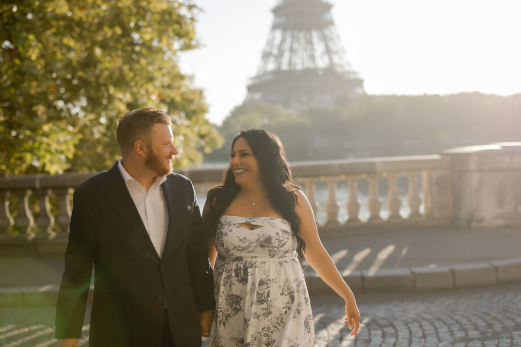 Romantic portrait of couple holding hands in Paris with eiffel tower in background by Katie Donnelly Photography