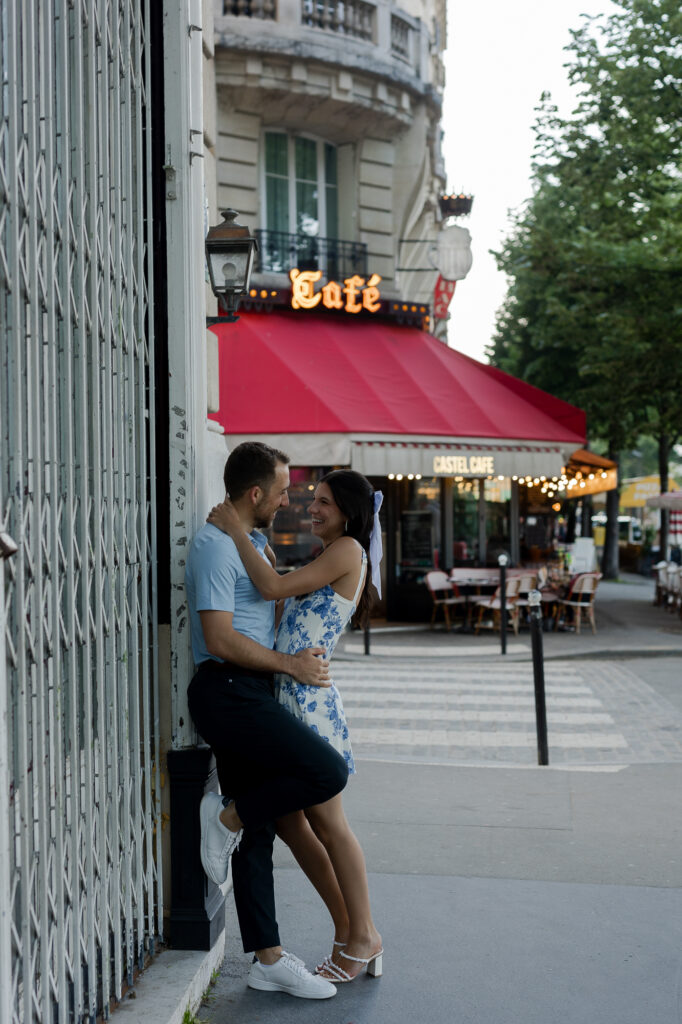 Portrait of couple leaning against building in Paris by Katie Donnelly Photography
