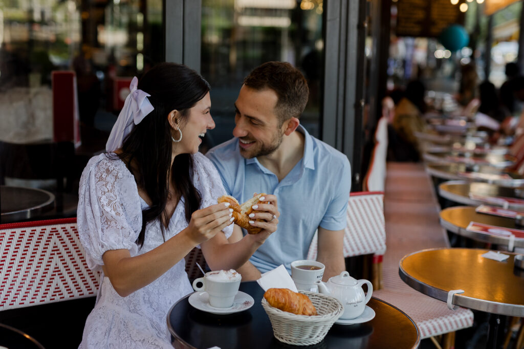 Portrait of couple sipping coffee at Paris cafe by Katie Donnelly Photography
