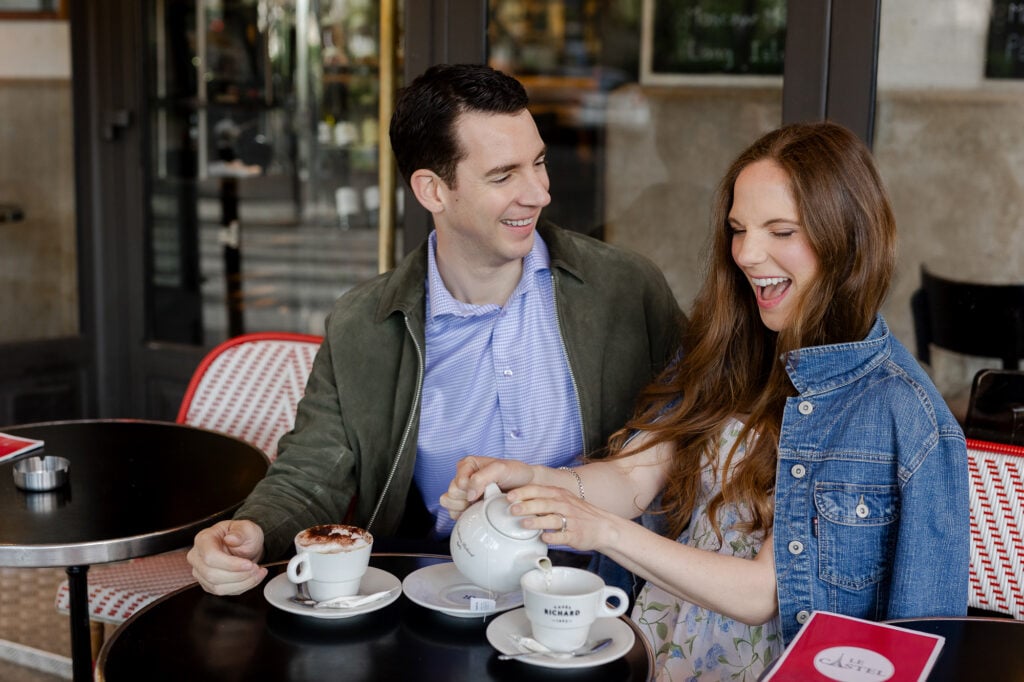 Portrait of couple with coffee at café in Paris by Katie Donnelly Photography