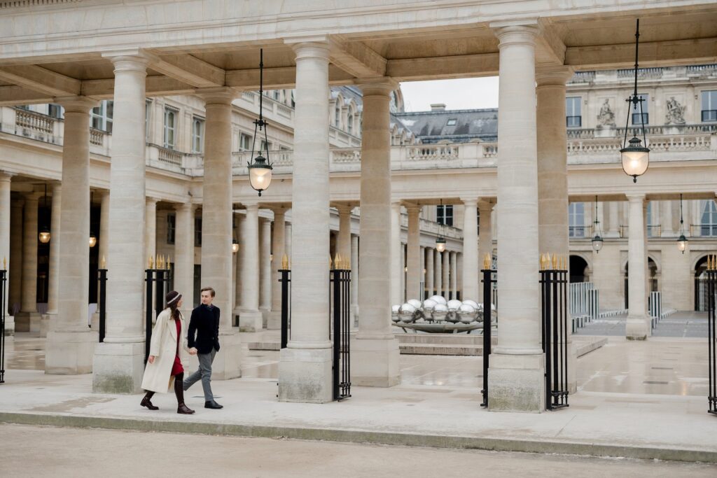Couple walking hand in hand by the Palais Royal in Paris, Katie Donnelly photography