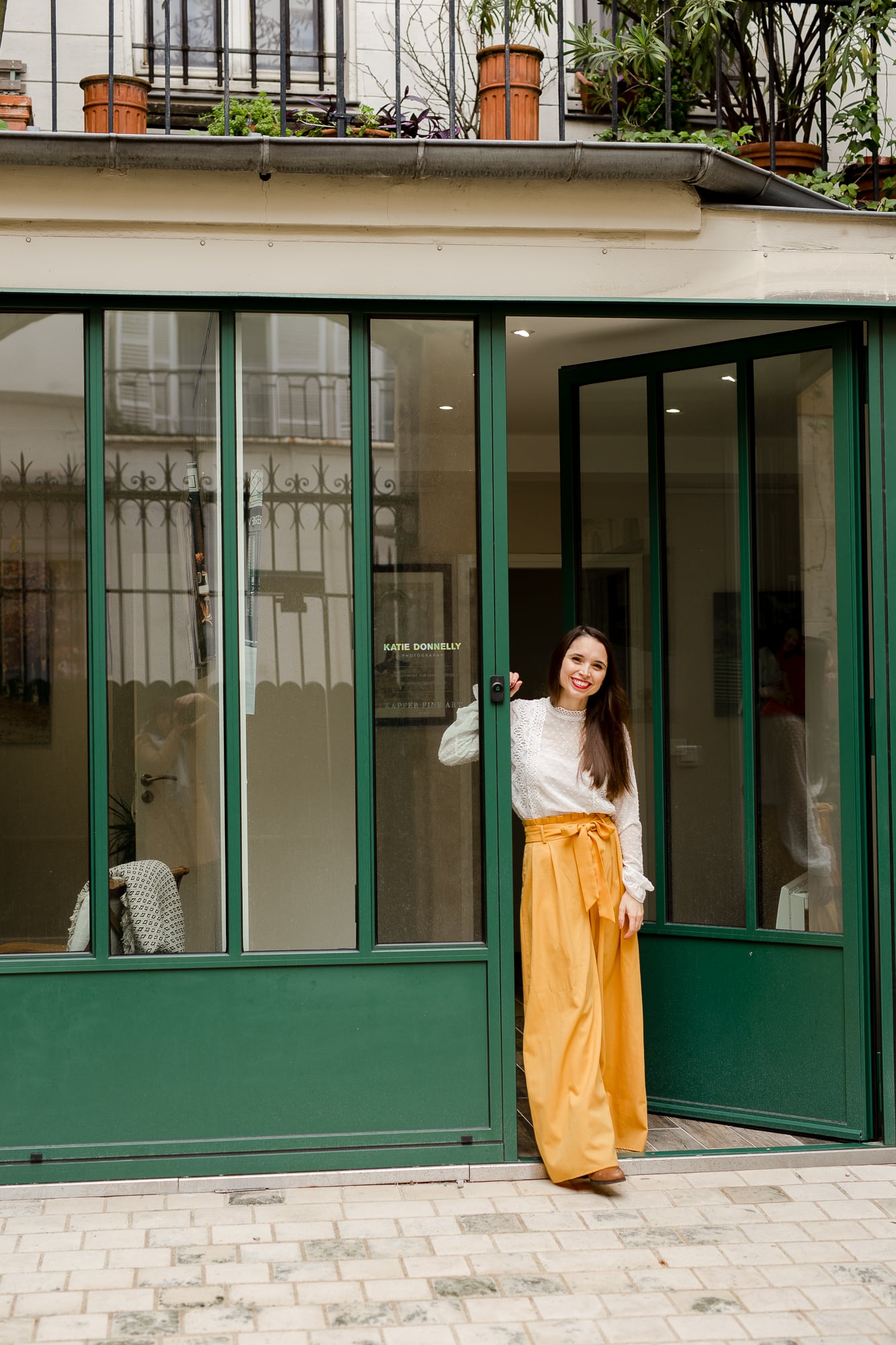 Katie Donnelly in the doorway of her photography studio in central Paris