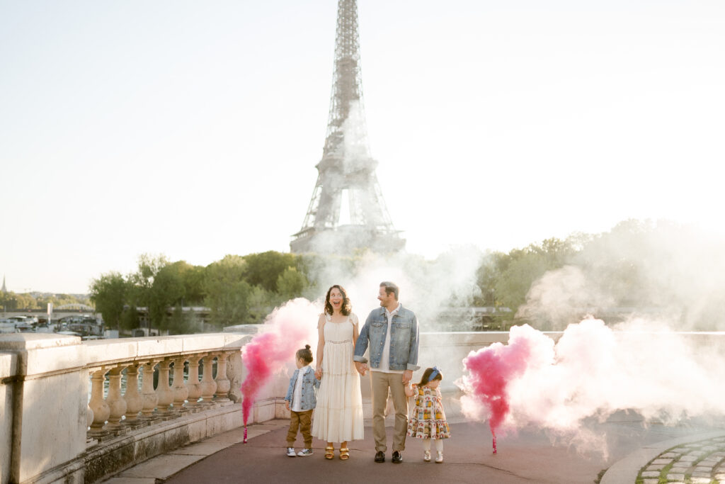 Portrait of family adding meaning to photoshoot at Trocadero in Paris with gender reveal celebration by Katie Donnelly Photography
