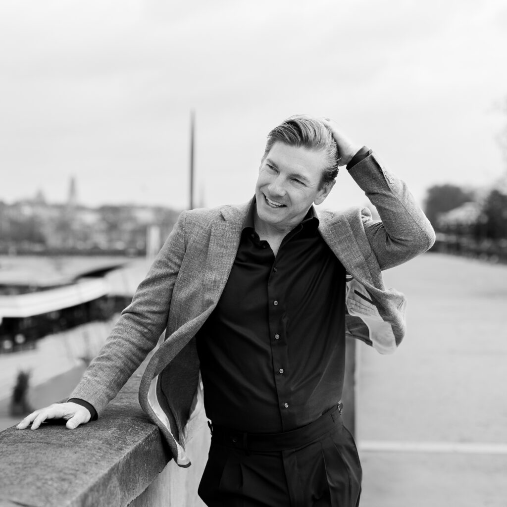 Man on a bridge in Paris, black and white photo