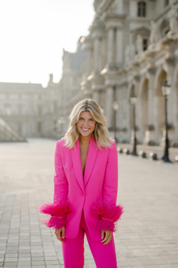 Elegant woman strolling by the Louvre in Paris