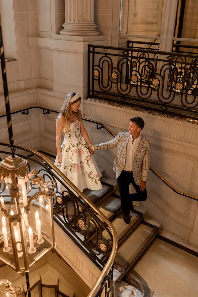 Portrait of couple walking down staircase at the Hôtel de Crillon in Paris by Katie Donnelly Photography