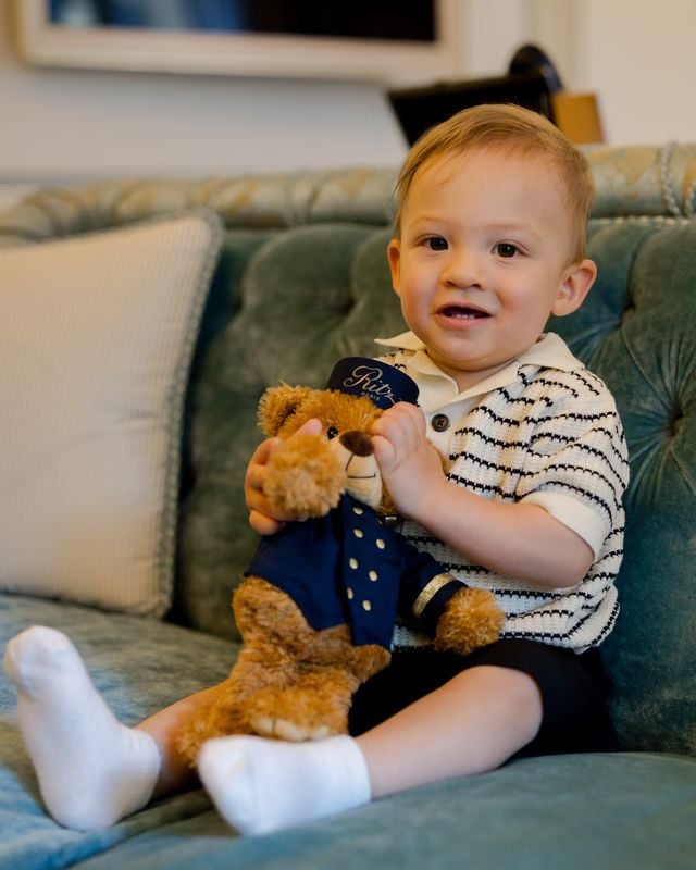 Portrait of toddler on sofa at the Ritz Hotel in Paris by Katie Donnelly Photography