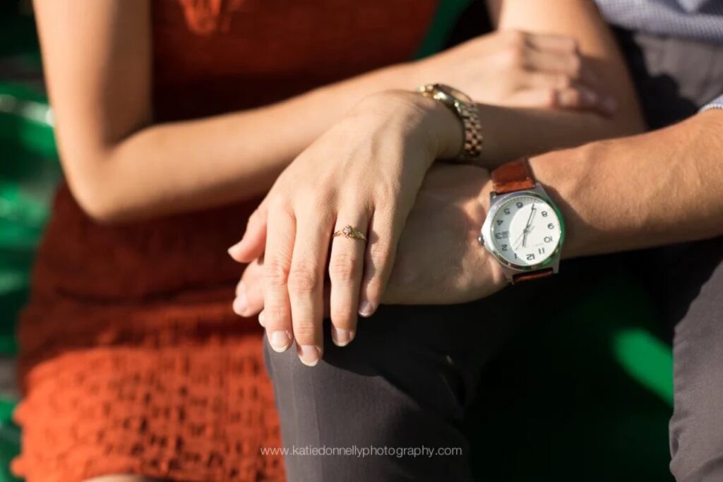 Close-up of an engagement ring on her hand after a proposal in Monet's garden