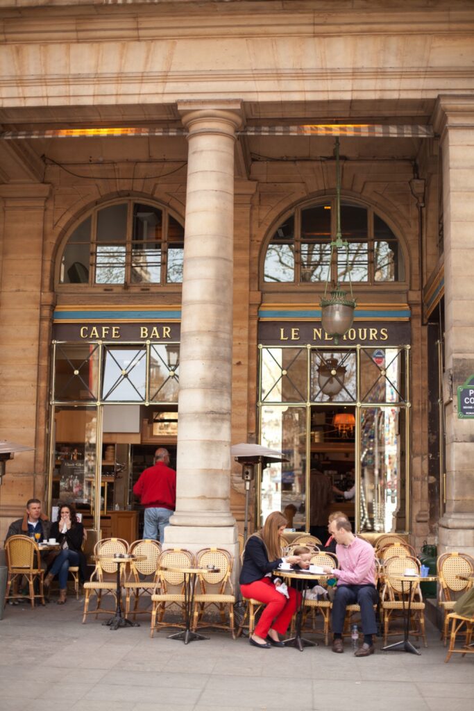Café terrace under the arcades of the Palais Royal in Paris